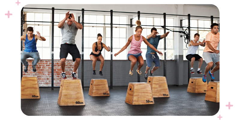 A class of adults enjoying an intense fitness class