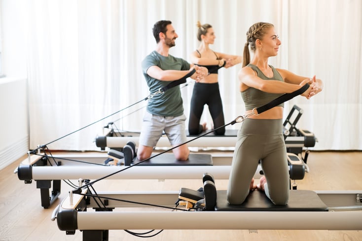 Pilates clients using Pilates machines in a Pilates studio