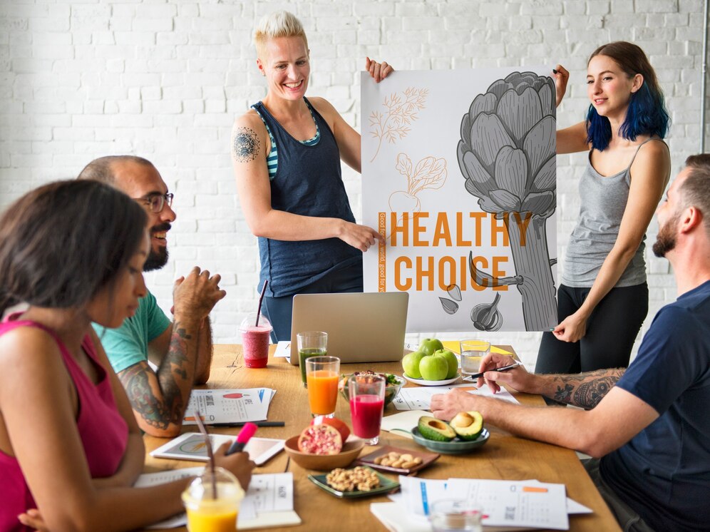 A group of people around a table during a nutrition coaching session.