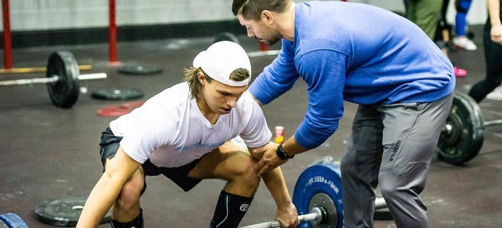 colchester fitness centre crossfit coach teaching a client