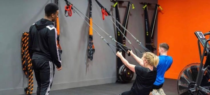 the fitness box instructor teaching a client