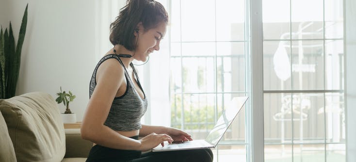 fitness owner sending an email to her clients