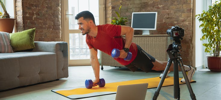 man filming a workout video