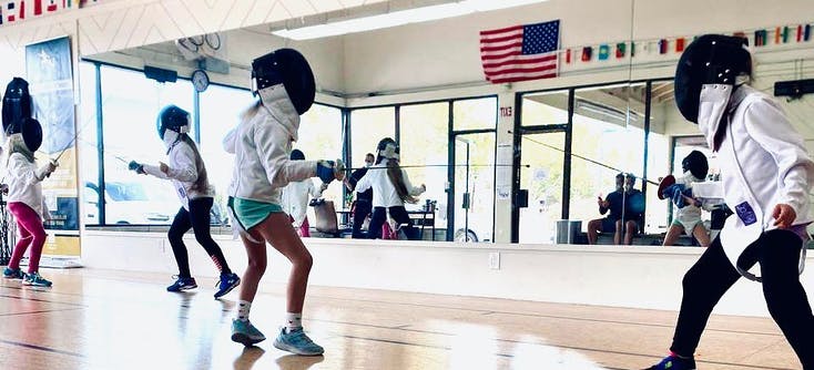 A fencing class in Olga's fencing studio