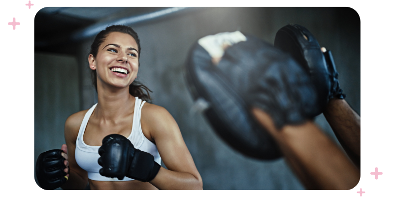 A martial arts student enjoying a martial arts class