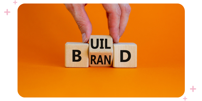 Wooden blocks that read "build-brand".