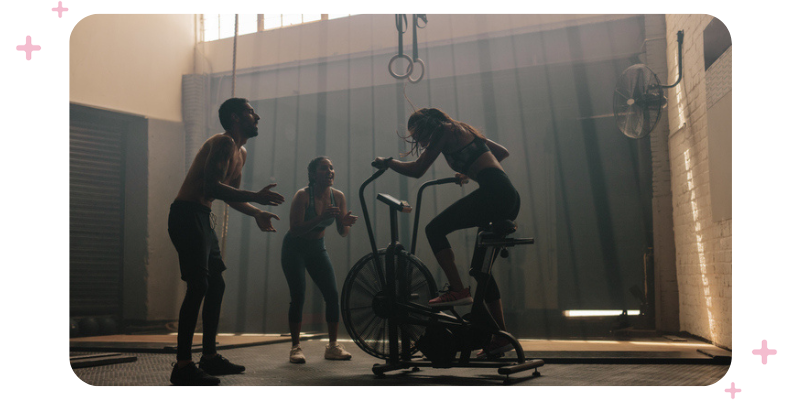 Friends cheering each other on at the gym.