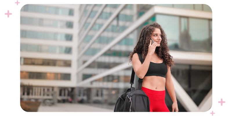 Girl in workout gear on her phone.