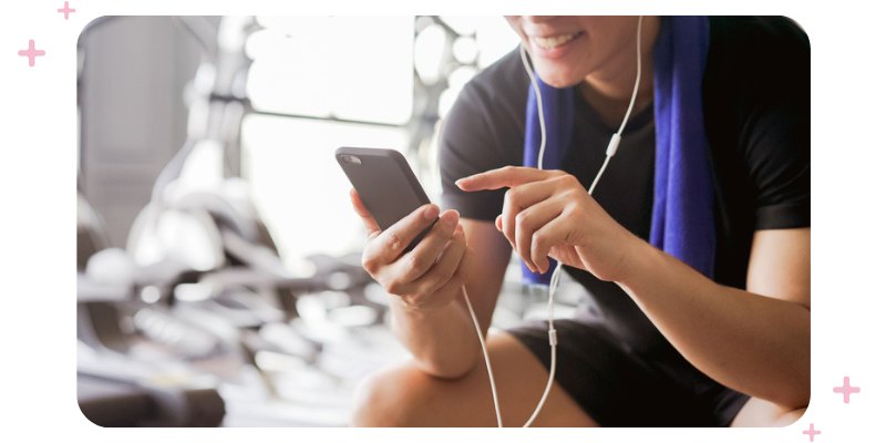 Person on their phone at the gym.