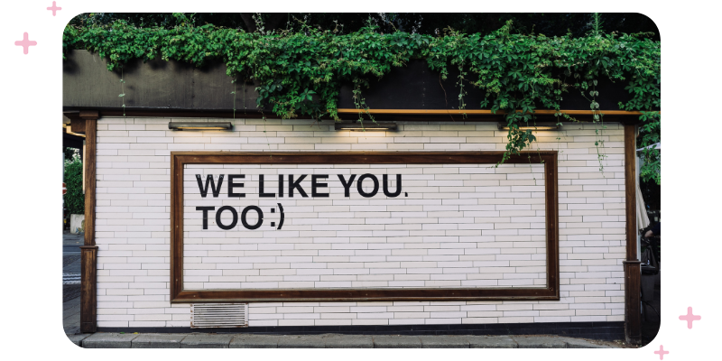 A sign on the side of a gym that reads "We like you too".