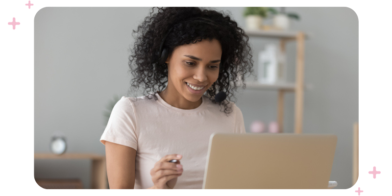 Woman sitting in front of a laptop.